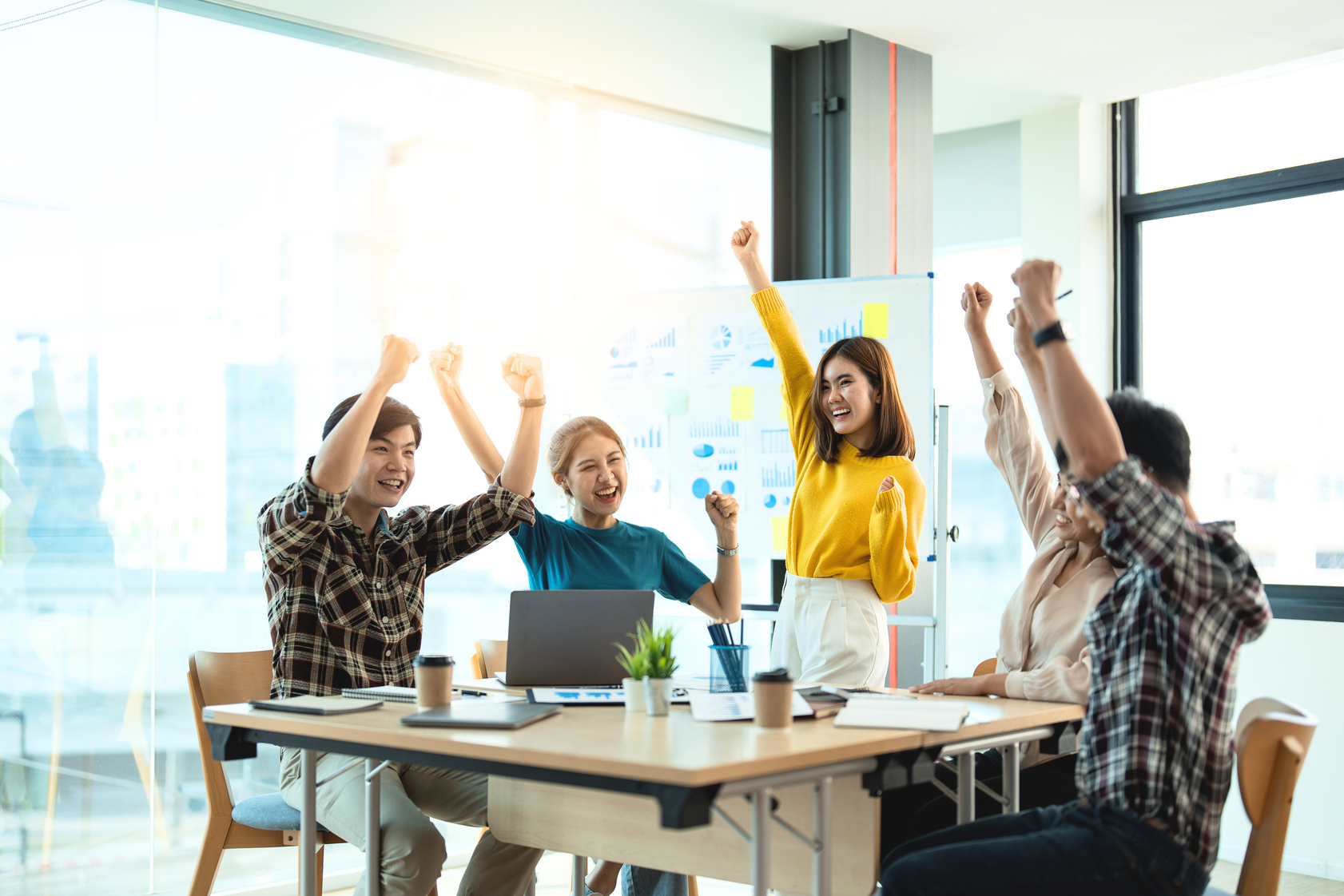 Successful business asian people group celebrating project s